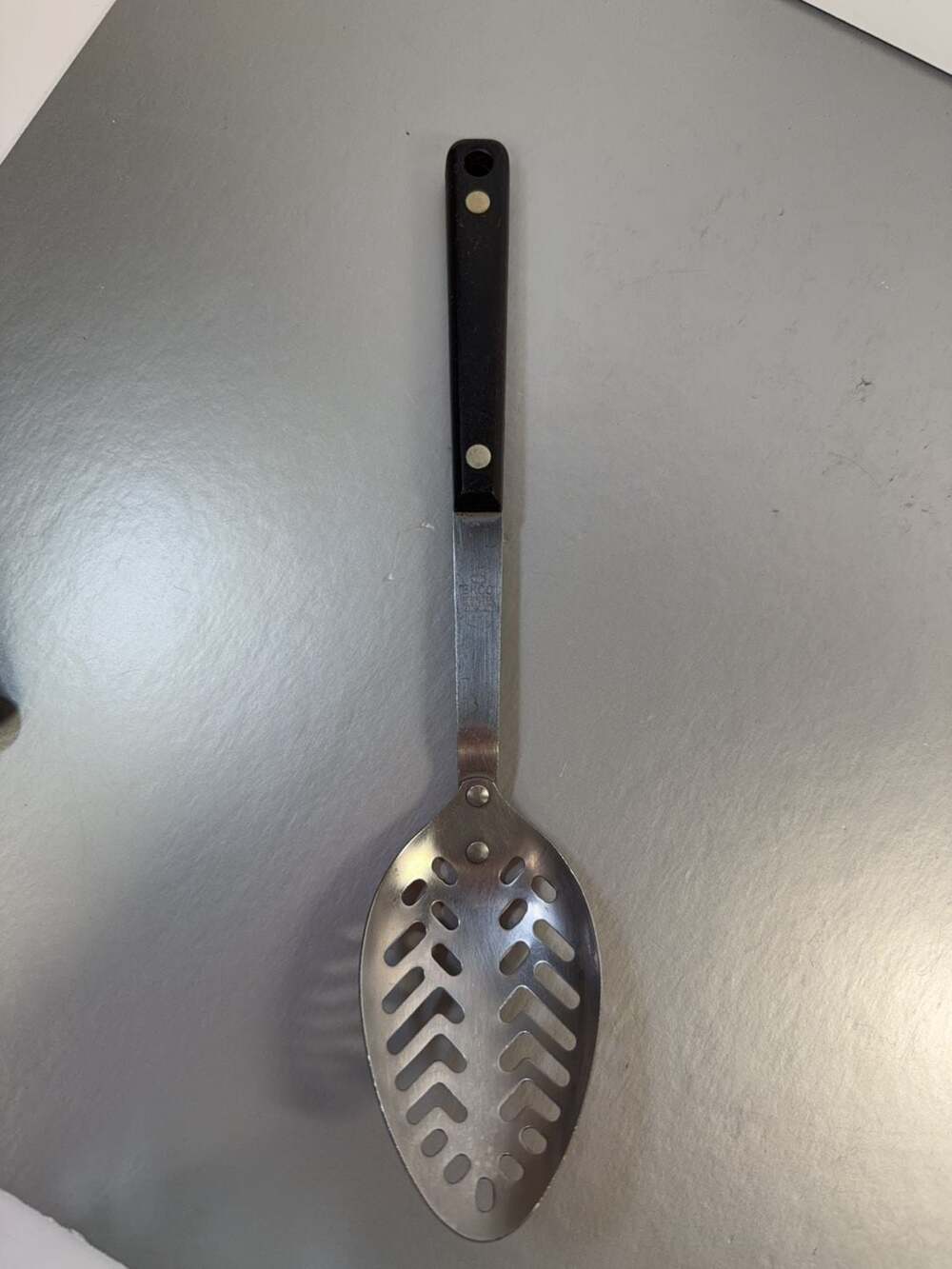 Vintage Ekco Stainless Vanadium Slotted Serving Spoon with Black Composite Handl - Picture 1 of 4